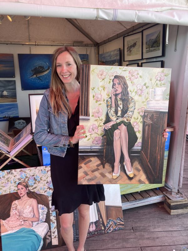 Model holding up portrait